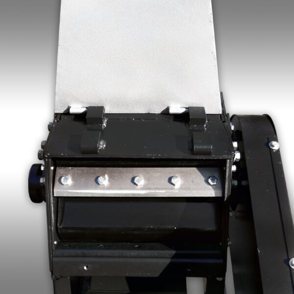 Close up of the rotating drum with sharp hardened steel blades