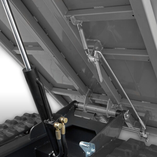 Close up photo of the bottom of the bucket on the Jansen USA RD-800, highlighting the hydraulic tipping, mechanism.